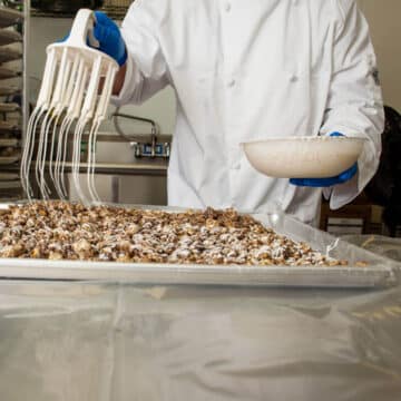 hand drizzling our fancy popcorn 