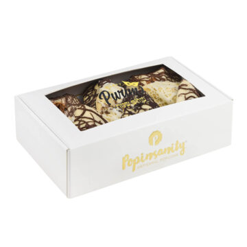 Celebrate Purim with an artisan Hamantashen trio—Caramel Chocolate Drizzle, S’mores, and Cookies & Cream—expertly packaged in a festive gift box.