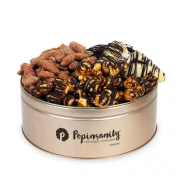 Fancy purim gift tin with gourmet popcorn, fresh baked hamantash and candied nuts