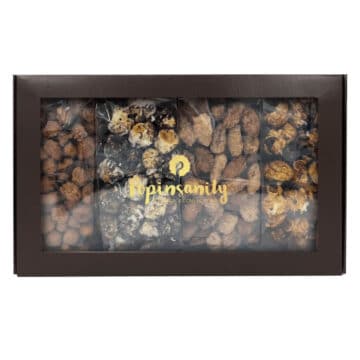 Fancy gift box with gourmet popcorn and artisan candied nuts
