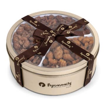 gourmet sugared nuts in a reusable gold gift tin with a popinsanity ribbon