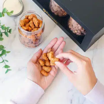 Luxury nut assortment in a bespoke gift box, symbolizing elegance and quality snacking