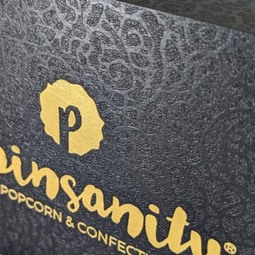 Custom designed premium giftbox with luxuriously detailed textures and gold foil popinsanity branding