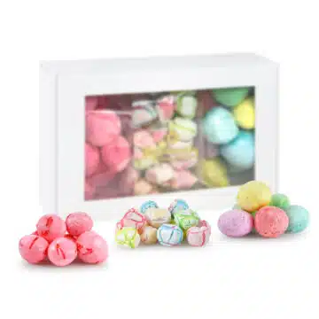 Handcrafted freeze-dried candy displayed in a sleek white gift box with three visible bags.