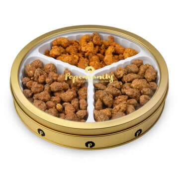 Celebrate with Popinsanity's Gourmet Nut Gift Tin: This festive tin is filled with a delicious selection of vegan and kosher nuts, making it the perfect choice for any celebration. From candied delights to dry-roasted classics, this mix offers something for everyone to enjoy.