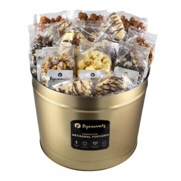 Gold Purim party tin filled with ten snack-size bags of gourmet popcorn, three artisan nut bags, and ten handcrafted gourmet Hamantashen.
