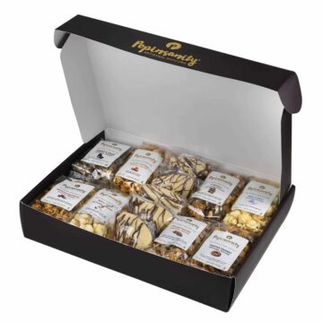 Celebrate Purim with a curated gift box of 8 snack-size artisanal popcorn bags and festive Hamantashen, drizzled with rich chocolate.