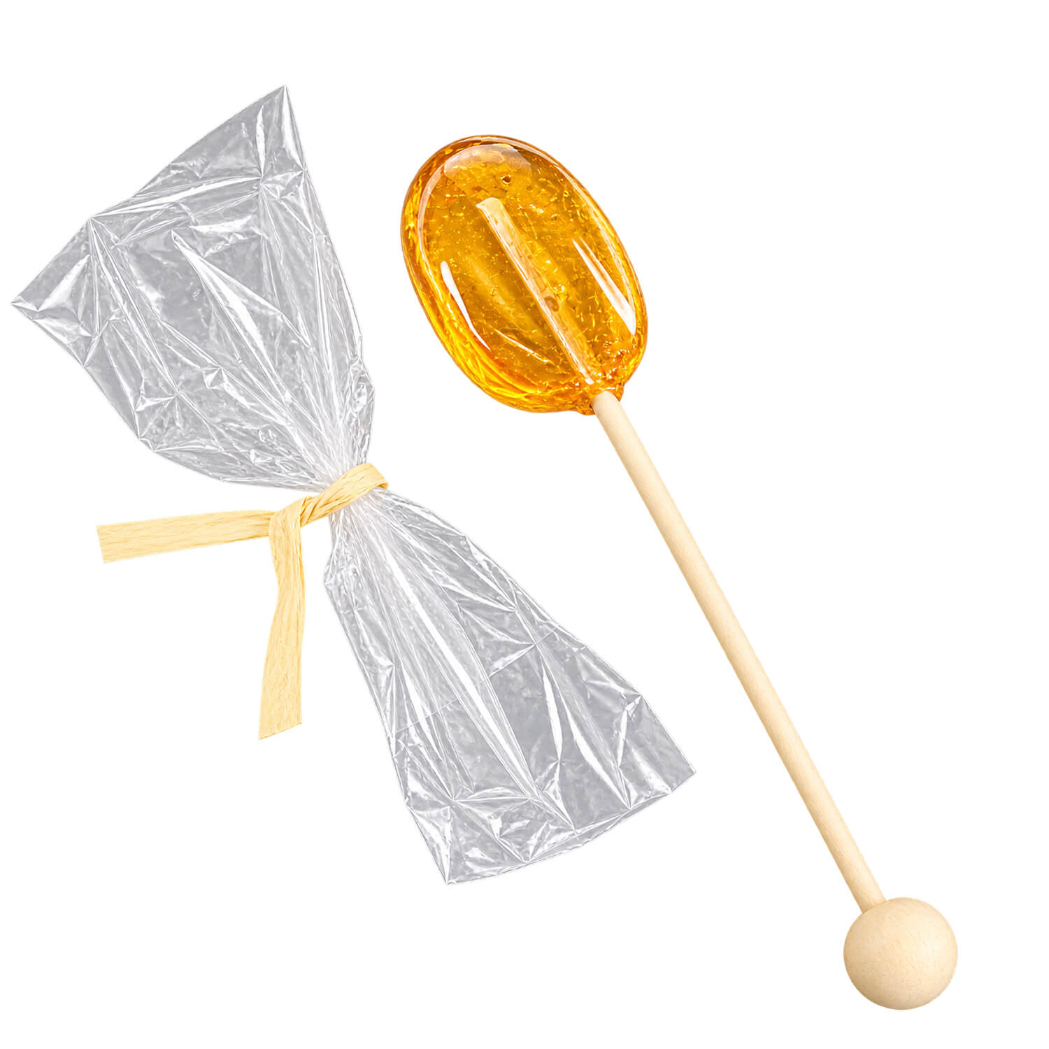 Clover Honey Spoon Hard candy honey lollipop shaped like a honey dipper on a wooden stick, placed next to a clear plastic wrapper with a yellow twist tie on a white background.