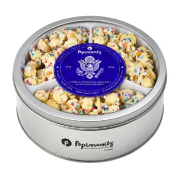 Gourmet America's Birthday Cake popcorn packed inside the limited-edition Semiquincentennial commemorative silver gift tin.