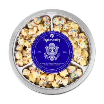 Luxury patriotic popcorn gift basket alternative featuring Popinsanity's Semiquincentennial commemorative birthday cake popcorn tin